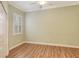Spacious bedroom with wood floors and plantation shutters at 206 Bella Vista Ter # 29B, North Venice, FL 34275