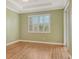Spacious bedroom with wood floors and sliding glass doors at 206 Bella Vista Ter # 29B, North Venice, FL 34275