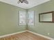 Light and airy bedroom with wood floors and plantation shutters at 206 Bella Vista Ter # 29B, North Venice, FL 34275