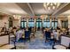 Spacious dining room with multiple tables and chairs at 206 Bella Vista Ter # 29B, North Venice, FL 34275