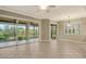 Bright dining room with tile floors and chandelier at 206 Bella Vista Ter # 29B, North Venice, FL 34275