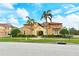 Luxury Mediterranean home with tile roof, three-car garage, and lush landscaping at 206 Bella Vista Ter # 29B, North Venice, FL 34275