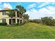 Building exterior with tropical landscaping at 206 Bella Vista Ter # 29B, North Venice, FL 34275