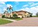 Luxury home with three-car garage and brick paver driveway at 206 Bella Vista Ter # 29B, North Venice, FL 34275