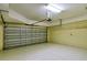 Spacious garage with open door, storage, and HVAC at 206 Bella Vista Ter # 29B, North Venice, FL 34275