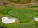 Aerial view of golfers on the green at 206 Bella Vista Ter # 29B, North Venice, FL 34275
