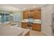 Modern kitchen with stainless steel appliances and granite countertops at 206 Bella Vista Ter # 29B, North Venice, FL 34275