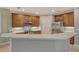 Modern kitchen with stainless steel appliances and white countertops at 206 Bella Vista Ter # 29B, North Venice, FL 34275