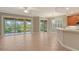 Bright kitchen with breakfast bar, tile floors, and access to patio at 206 Bella Vista Ter # 29B, North Venice, FL 34275