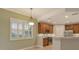 Kitchen features wood cabinets and a breakfast bar at 206 Bella Vista Ter # 29B, North Venice, FL 34275