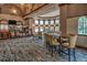 Elegant lounge with bar, seating, and large windows at 206 Bella Vista Ter # 29B, North Venice, FL 34275