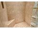 Large tiled shower with built-in seat at 206 Bella Vista Ter # 29B, North Venice, FL 34275
