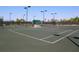 Well-lit tennis courts with seating at 206 Bella Vista Ter # 29B, North Venice, FL 34275