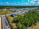 A lovely residential area surrounded by beautiful greenery, a tranquil lake, and numerous mature trees at 2164 Midnight Pearl Dr, Sarasota, FL 34240