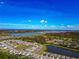 Scenic aerial view highlighting a peaceful community near several lakes and natural surroundings at 2164 Midnight Pearl Dr, Sarasota, FL 34240