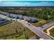 A well-planned community with neatly arranged homes, green lawns, and easy access to nearby amenities and roadways at 2164 Midnight Pearl Dr, Sarasota, FL 34240