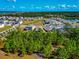Community aerial view showcasing green spaces, lush landscaping, and beautiful waterfront access at 2164 Midnight Pearl Dr, Sarasota, FL 34240