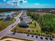 New homes along a tranquil lake and lush wooded areas offering a blend of suburban comfort and natural beauty at 2164 Midnight Pearl Dr, Sarasota, FL 34240