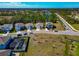 Real estate boasting spacious lots, manicured lawns, and a tranquil pond providing a serene backdrop at 2164 Midnight Pearl Dr, Sarasota, FL 34240
