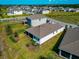 Aerial view of the back exterior featuring a screened-in patio and well-maintained lawn at 2164 Midnight Pearl Dr, Sarasota, FL 34240