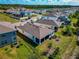 Aerial view of the back exterior featuring a screened-in patio and well-maintained lawn at 2164 Midnight Pearl Dr, Sarasota, FL 34240