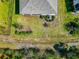 Aerial view of the backyard and fence, with a landscaped area in the corner at 2164 Midnight Pearl Dr, Sarasota, FL 34240