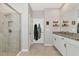 Bathroom with a walk-in shower, double vanity and tile flooring at 2164 Midnight Pearl Dr, Sarasota, FL 34240