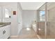 Bathroom featuring a large vanity, walk-in shower, and separate tub at 2164 Midnight Pearl Dr, Sarasota, FL 34240
