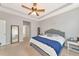 Spacious bedroom featuring tray ceiling, ceiling fan, and carpeted floors at 2164 Midnight Pearl Dr, Sarasota, FL 34240