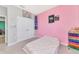 Charming bedroom featuring neutral walls, a cozy bed, and ample closet space for storage at 2164 Midnight Pearl Dr, Sarasota, FL 34240