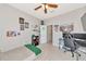 Spacious bedroom with desk and computer setup, as well as a single bed and gaming decor at 2164 Midnight Pearl Dr, Sarasota, FL 34240