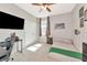 Neutral-toned bedroom with a large television, closet, and a comfortable-looking bed at 2164 Midnight Pearl Dr, Sarasota, FL 34240
