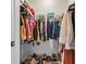 Organized walk-in closet with clothing racks and shoe storage, maximizing space at 2164 Midnight Pearl Dr, Sarasota, FL 34240