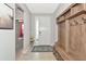 Inviting foyer featuring tile flooring, coat rack, and a glimpse into other rooms at 2164 Midnight Pearl Dr, Sarasota, FL 34240