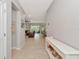 Bright foyer with tile floors leading to the living spaces and a decorative console table at 2164 Midnight Pearl Dr, Sarasota, FL 34240