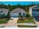 Charming single-Gathering home featuring a two-car garage and a well-manicured lawn at 2164 Midnight Pearl Dr, Sarasota, FL 34240