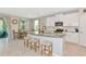 Kitchen features a large island, stainless steel appliances and breakfast nook at 2164 Midnight Pearl Dr, Sarasota, FL 34240