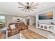 Open-concept living room and kitchen with modern appliances and stylish furnishings at 2164 Midnight Pearl Dr, Sarasota, FL 34240