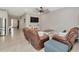 Open living space with comfortable seating, large screen television, and lots of natural light at 2164 Midnight Pearl Dr, Sarasota, FL 34240