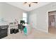 Bright office space with a ceiling fan, neutral-colored walls, and a work desk near a window at 2164 Midnight Pearl Dr, Sarasota, FL 34240