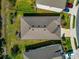 Birds eye view of a houses roof and backyard, with the neighbor's roofs showing around it at 2164 Midnight Pearl Dr, Sarasota, FL 34240