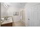 Double vanity bathroom with large mirror and walk-in shower at 2200 Pratt Avenue, North Port, FL 34286