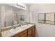Bathroom boasts double sinks, large mirror, and a shower stall at 2200 Pratt Avenue, North Port, FL 34286