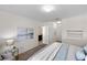 Main bedroom with large bed, ensuite bathroom access, and window with view at 2200 Pratt Avenue, North Port, FL 34286