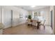 Bright dining room with wooden table and six chairs, near sliding doors at 2200 Pratt Avenue, North Port, FL 34286