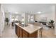 Open concept kitchen with island, looking toward dining and living areas at 2200 Pratt Avenue, North Port, FL 34286