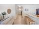 Kitchen with island, light cabinets, and black appliances at 2200 Pratt Avenue, North Port, FL 34286