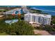 Beautiful view of apartment community with manicured landscaping, marina, and tennis courts at 2550 Harbourside Dr # 322, Longboat Key, FL 34228
