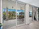 This condo features a tiled balcony with sliding glass doors and views of the beautiful landscape at 2550 Harbourside Dr # 322, Longboat Key, FL 34228