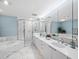 Elegant bathroom featuring double sinks, a soaking tub, and a separate marble shower at 2550 Harbourside Dr # 322, Longboat Key, FL 34228